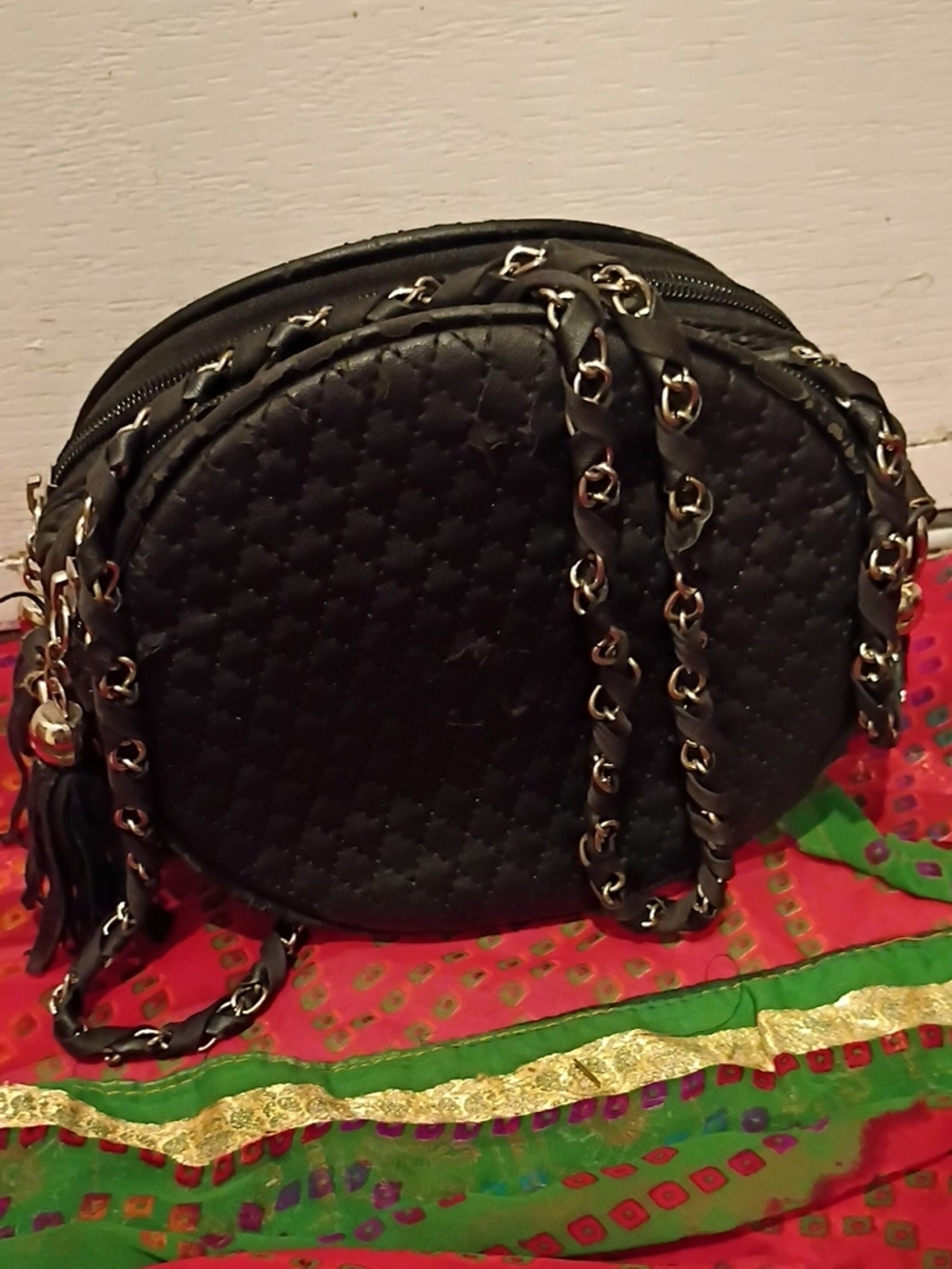 Black Quilted Round Crossbody with Chain-Tassel Detail